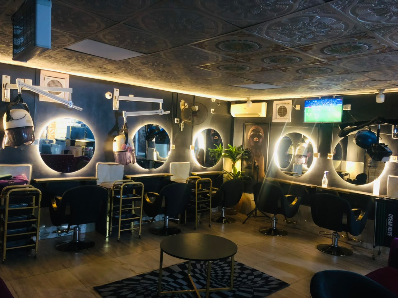 TripleD salon interior with backlit mirrors and styling stations